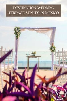 destination wedding terrace venue in mexico with purple flowers and white drapes on the beach