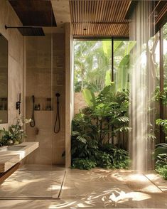 a bathroom with a shower, sink and large window in it's center area