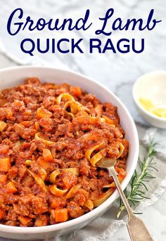 a close up of a bowl of ground lamb quick ragu with a spoon in it