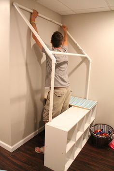 two pictures of the inside of a dollhouse with shelves and furniture in it, including a child's bed