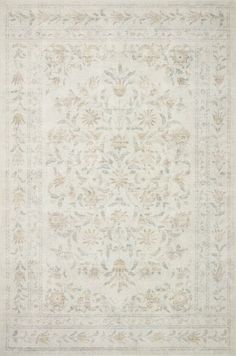 a white rug with an ornate design on it