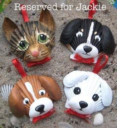 there are four animal head ornaments in the sand with words reserved for jackie on them