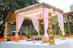 an outdoor wedding setup with flowers and decorations