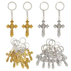 four different types of key chains with crosses on them