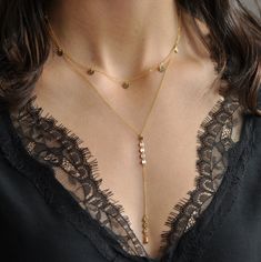 "This is a show stopper lariat necklace. Its dainty and sparkly chains are beautiful layered with other favorites. This is definitely a piece you should have in your jewelry collection!! Our gift to you 10% off your first purchase. Details here - http://eepurl.com/dpVPBz DETAILS Chain drop is approximately 3 3/4\" long Super sparkly dainty chain and sequin/disc chain 14 k gold fill or sterling silver chain and components Length choice from 15\" to 24\" Our model is wearing necklace at approximat Dainty Lariat Charm Necklace With Delicate Chain, Delicate Lariat Charm Necklace, Dainty Lariat Necklace With Delicate Chain, Delicate Layered Lariat Necklace With Delicate Chain, Dainty Gold Backdrop Necklace With Clavicle Chain, Delicate Gold Backdrop Necklace With Clavicle Chain, Adjustable Dainty Lariat Necklace For Layering, Dainty Drop Necklace For Layering With Adjustable Chain, Delicate Gold Lariat Necklace With Dangle