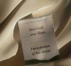 a piece of cloth with the words don't sell your haya for a portion of this dunya