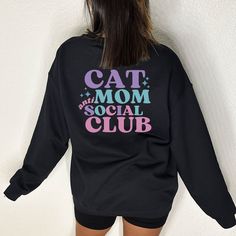 🌟 Cat Moms are the backbone of the home and this sweatshirt is the ultimate gift! Made with high-quality materials, this sweatshirt is comfortable and makes a statement. ✨ Consider sizing up for oversized look ✨ Model sized up 2 sizes for oversized look ✨ Loose fit ✨ 50% cotton, 50% polyester ✨ Medium-heavy fabric ✨ Sewn-in label Oversized Crew Neck Tops With Cat Print, Oversized Cat Print Crew Neck Top, Black Cotton Sweatshirt With Cat Design, Casual Black Sweatshirt With Cat Design, Relaxed Fit Long Sleeve Sweatshirt With Cat Print, Black Crew Neck Sweatshirt With Cat Design, Trendy Crew Neck Sweatshirt With Cat Design, Casual Relaxed Fit Sweatshirt With Cat Design, Casual Relaxed Fit Sweatshirt With Cat Print