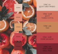 some blood oranges and other fruits with leaves on them are featured in this color scheme