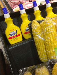 corn on the cob and mustard in plastic bags next to other packaged food items