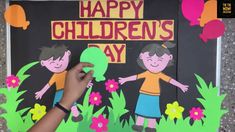 a person holding up a sign that says happy children's day