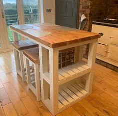 a kitchen island with two wine bottles on it