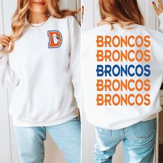 a woman wearing a sweatshirt with the words broncos and broncos printed on it