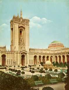 an old painting of a large building with a clock tower in the middle of it