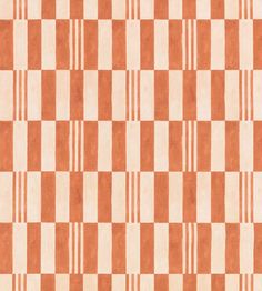 an orange and white checkered rug is shown