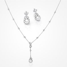 PLATINUM EVARA JEWELLERY BY JEWELOVE With the infinity bond at the heart of its contemporary design, this Platinum Evara set symbolizes everlasting relationships. Interspersed with diamonds, this jewellery is sure to bring out your sublime beauty. Metal : Platinum Platinum Purity : 95% Purity Mark : Pt 950 Finishing : Hi-polish Estimated Platinum Weight Necklace : 8.25 grams Earrings : 5.75 grams Estimated Diamond Weight Necklace : 0.32 cts. Earrings : 0.16 cts. Diamond Clarity : SI Diamond Colo Om Pendant, Platinum Chain, Platinum Rose Gold, Chain For Women, Bridal Fashion Jewelry, Casual Jewelry, Platinum Jewelry, The Infinity, Modern Necklaces