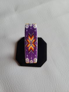 "I use size 15 seed beads. The length is 6\" and width is 3/4\". Product is an adjustable cuff bracelet with pig skin covering." Handmade Adjustable Purple Cuff Bracelet, Artisan Beaded Adjustable Cuff Bracelet, Adjustable Purple Beaded Wristband, Native Beadwork, Native American Beading, Pig Skin, Beautiful Bracelet, Beaded Bracelet, Cuff Bracelet