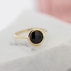 Black onyx 14K gold ring. A dainty, delicate black onyx gemstone ring, ideal for stacking for every woman who loves elegance. An excellent choice for anniversary gift or birthday gift for her. 100% handcrafted with love! D E T A I L S ● Metal: 14K solid gold, 14K white gold or 14K rose gold ● Gemstone: Black Onyx, briolette cut ● Stone Diameter: 8mm (0.31in), 10mm (0.4in) and 12mm (0.5in) R I N G ∙ S I Z I N G For General Reference: ● we use standard US Ring Sizing ● an average women's ring fing Minimalist Onyx Ring For Formal Occasions, Minimalist Onyx Rings For Formal Occasions, Minimalist Onyx Gemstone Ring, Faceted Round Onyx Jewelry, Elegant Round Onyx Rings, Minimalist Onyx Signet Ring, Black Birthstone Rings, Round Onyx Jewelry For Anniversary, Onyx Signet Ring For Gift