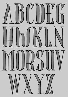 the upper and lower case of an old english alphabet, with black ink on gray paper