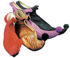 three pairs of shoes that are laying on top of each other in the shape of an elephant