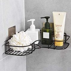 a bathroom shelf with soap, shampoo and lotion on it