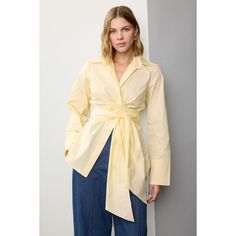 Yellow cotton (100% Cotton). Top. Long sleeves. Collared neckline. Front button closure. 29" from shoulder to hemline. Imported. Chic Cotton Blouse With Spread Collar, Cotton Shirt For Spring Daywear, Chic Long Sleeve Cotton Blouse, Spring Cotton Tops With Button Closure, Chic Cotton Top With Spread Collar, Fall Cotton Blouse With Placket, Spring Blouse With Spread Collar And Placket, Cotton Blouse With Button Closure For Fall, Cotton Blouse With Placket For Fall