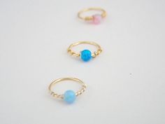 This listing is for ONE or more tiny dainty 14k gold filled hoop with tiny 3mm loose Fire Opal bead. If you buy more than one you get a discount (please take a look at the style options Please choose your style. size: gauge: 22g. inner diameter:8mm. FOR different size please contact me. ★To open the ring gently twist the ends sideways, slip into the hole and then gently twist the ends back for a continuous hoop. ★PLEASE NOTE: All pieces are created by hand, so there can be slightly difference be Dainty Adjustable Tiny Nose Rings, Dainty Tiny Adjustable Nose Rings, Dainty Stackable Cartilage Earrings As Gift, Dainty Stackable Cartilage Earrings For Gift, Dainty Small Hoop Septum Ring, Dainty Tiny Small Hoop Septum Ring, Dainty Adjustable Tiny Septum Ring, Adjustable Dainty Septum Ring, Opal Cartilage Earring