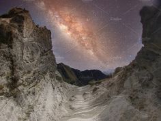 the night sky with stars and milky in the background, taken from an overlook point