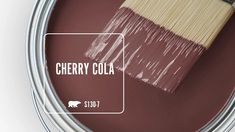 a can of cherry cola with a paint brush