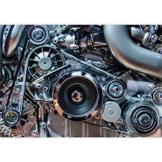 the engine of an automobile is shown in this close up shot, it has many different parts