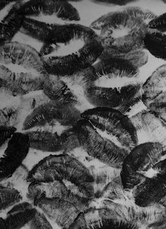 black and white photograph of many different types of lips on a sheet of paper that has been drawn onto it