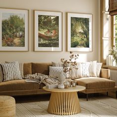 a living room filled with furniture and pictures on the wall above it's coffee table