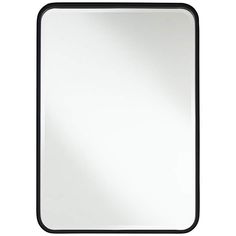 a black framed mirror on a white background