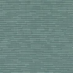 an upholstered wallpaper pattern in blue and green colors with small dots on the surface