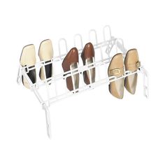 the shoe rack is holding several pairs of shoes