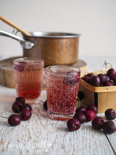 a jar filled with jam next to sliced onions and an onion wedge on a wooden table