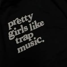 the words pretty girls like trap music printed on a black hoodie with white letters