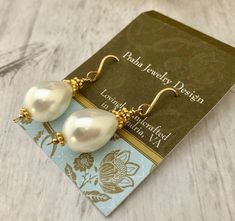 Stunning earrings, perfect for the bride. Made from shell composite, but resemble high-quality freshwater pearls. The earrings measure 1 3/4" from the top of the 14K GF handcrafted ear wire. The shell "pearls" measure 20mm x 12mm. All wire is 14K GF wire used with 24K vermeil accents. Pear-shaped Pearl Charm Earrings For Anniversary, Pear-shaped Pearl Earrings With Pearl Charm, Pear-shaped Pearl Drop Earrings, Pear-shaped Teardrop Earrings With Pearl Charm, Teardrop Pearl Earrings With French Hook For Gift, Gold Pearl Earrings With Pear Shape And Ear Wire, Gold Pearl Earrings With Pear Shape, Gold Pear-shaped Pearl Earrings With Ear Wire, Pear-shaped Pearl Earrings With Ear Wire