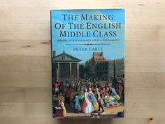 the making of the english middle class book sitting on top of a wooden table next to a wall