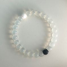 Never Worn!! Handmade Elegant Clear Bracelets, Elegant Handmade Clear Bracelets, Modern White Bracelets With Round Beads, Modern White Round Beads Bracelets, Modern White Round Bead Bracelets, Elegant Clear Beaded Bracelets With Adjustable Fit, Casual Silver Round Crystal Bracelet, Elegant Adjustable Clear Beaded Bracelets, Simple Adjustable White Bracelet