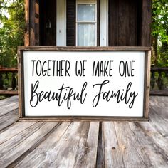 a wooden sign that says together we make one beautiful family on it's front porch