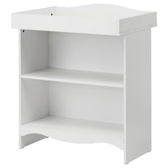 a white shelf with two shelves on each side and an open door at the top