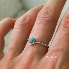 Silver V Shaped Ring.  Material: 100% Sterling Silver✨Stamped 925 silver. Handmade 🤲🏻 Gentle on the sensitive skin. Discover the simplicity and charm of our sterling silver peak ring, accented with a delightful turquoise stone for a touch of vibrancy. This understated yet captivating piece effortlessly complements other rings in your collection, adding a pop of joy and color to any ensemble. Its refined design and versatile appeal make it a versatile addition to your jewelry box, perfect for b Turquoise Gemstone Stackable Rings In Sterling Silver, Blue Turquoise Stackable Open Ring, Stackable Blue Turquoise Ring In Sterling Silver, Minimalist Sterling Silver Turquoise Promise Ring, Sterling Silver Turquoise Ring As Birthstone, Turquoise Birthstone Ring In Sterling Silver, Elegant Turquoise Sterling Silver Stackable Rings, Turquoise Blue Sterling Silver Toe Ring, Turquoise Sterling Silver Promise Ring