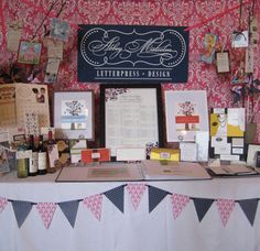 the table is covered with papers and cards