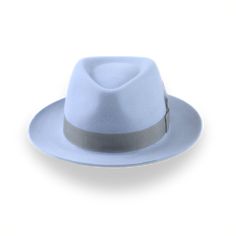 Description Materials Craftsmanship Hat Care Shipping Returns Product Description A Medium Crown Design for a Sleek Look Upgrade your style game with the Clubber, a light blue fur felt fedora that makes a bold statement. Crafted from luxurious fur felt, this hat features a medium crown and is adorned with a sleek grey grosgrain ribbon band, complete with a stylish feather. Whether you're dressing up for a night out or adding a touch of sophistication to your everyday look, the Clubber is versati Mens Felt Hats, Spanish Hat, Homburg Hat, 1940 Style, Gambler Hat, Mens Hats Fashion, Fedora Hat Men, Homburg, Personalized Hats