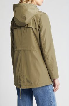 This timeless jacket is topped with a drawstring hood and styled with a chest zip pocket that's perfect for keeping small valuables secure. 30" length Front zip closure with snap storm placket Drawstring hood Chest zip pocket; front welt pockets Drawstring hem Lined 100% polyester Machine wash, tumble dry Imported Travel Hooded Jacket With Double-lined Hood, Hooded Windbreaker With Adjustable Hood For Travel, Travel Windbreaker With Adjustable Hood, Casual Travel Hooded Jacket With Adjustable Hood, Utility Hooded Parka With Zipper Closure, Functional Hooded Parka With Zipper Closure, Casual Travel Windbreaker With Drawstring Hood, Casual Windbreaker With Drawstring Hood For Travel, Hooded Parka With Pockets For Travel