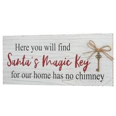 a sign that says here you will find santa's magic key for our home has no chimney