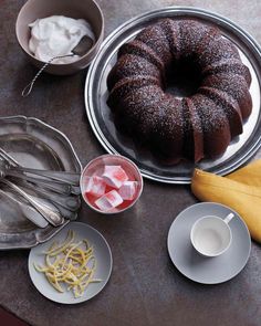 a chocolate bundt cake surrounded by other dessert items