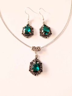 Victorian Emerald green Silver jewelry set dark green set necklace earrings Victorian jewelry set Bohemian set Vintage style jewelry set Silver Emerald green Victorian set necklace earrings . Bohemian necklace and earrings . Beautiful Set of silver-tone Antique style beads dark emerald green necklace and earrings. Silver  tone pendant Victorian style necklace and earrings. Boho necklace. Bohemian necklace and earrings. Romantic necklace and earrings.  Perfect Gift for girlfriend,  mother,  sister,  bridesmaids or Maid of honor. Gift for special people or jewelry set for your special occasion. FREE SHIPPING  Material: silver toned metal ornaments , dark green faceted teardrop glass cabochon, silver toned chain Length of necklace:  18.20 ( 46 cm), pendant 1.5 (3.8 cm.) Length of earrings wit Green Jewelry Sets As A Gift, Green Pendant Jewelry With Matching Earrings, Green Handmade Pendant Jewelry Sets, Handmade Green Pendant Jewelry Sets, Green Pendant Jewelry Sets As Gift, Elegant Green Dangle Jewelry Sets, Green Dangle Costume Jewelry, Green Costume Jewelry Sets For Gifts, Bohemian Green Necklaces With Matching Earrings