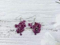 Beautiful lilac flower earrings for every lovely day. The life of the real lilacs is too short to make some flower earrings with them. Instead of real flowers, I offer you these beautiful handmade that will never fade. Such a piece of floral jewelry can please you for many years. They will beautifully adorn your look in any season of the year. Details: * Designed with handmade lilacs out of cold porcelain (air dry clay); * Total length 2.4 inches (6 cm), width 1 inch (2.5 cm); * Base color will Purple Handmade Flower Earrings, Handmade Purple Flower Earrings, Elegant Purple Polymer Clay Earrings, Handmade Lavender Flower Drop Earrings, Purple Flower Earrings With 3d Flowers As A Gift, Purple 3d Flower Earrings For Gift, Purple 3d Flower Earrings As Gift, Lavender Flower Earrings With Ear Wire, Delicate Purple Flower Earrings