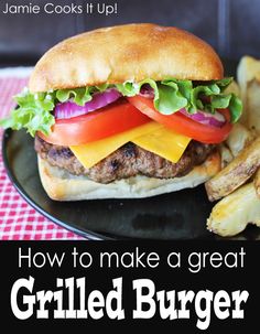 a grilled burger on a plate with french fries